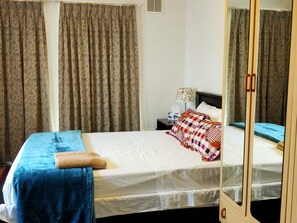 Extra Large 2nd Master Bedroom with a Queen Bed,  Recliner Chair & Wardrobes.