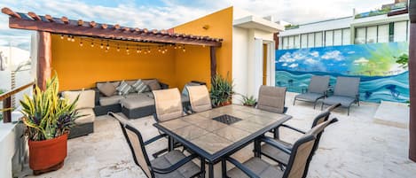 Your private roof deck with lounge chairs, patio table, BBQ, outdoor shower.