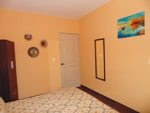 Closet, large sliding doors leading to the backyard and patio area