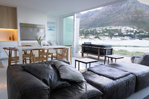 Top floor balcony, dining, lounge, kitchenette & barbecue.