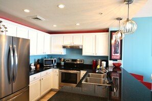 Fully stocked kitchen with blender and both K cup and drip coffee makers.