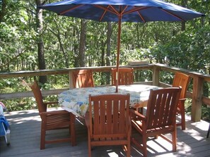 Teak dining table with umbrella