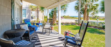 Porch - Plenty of seating on the porch for everyone to enjoy morning coffee before a beach day.