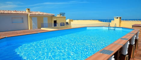 Take a refreshing dip in the stunning rooftop pool