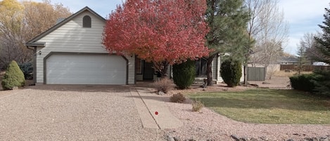 Front of home in Fall. No neighbor to one side nor in back. Safe gated community