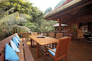 Upstairs dining area with sea and cliff views.