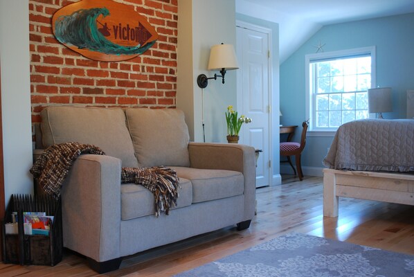 Cozy seating for two (pull -out twin sofa bed) and chairs for additional seating