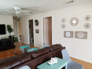 Living Room View with Bedroom Doors.