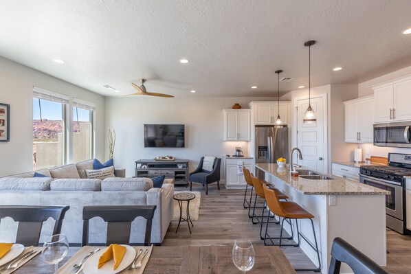 Side View of Living Area - The living room is designed as an open floor plan and is a great gathering place for meals, games, or watching TV during your stay. Notice the view from this room!
