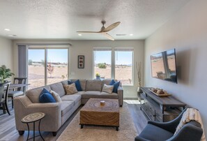 Living Room - RELAX IN THE PLUSH SOFA, PUT YOUR FEET UP AND WATCH YOUR
FAVORITE SHOW.