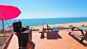 Private sun roof terrace with barbecue, sun loungers, tables, sea view