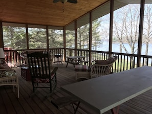 The picnic table on the screened in porch seats 10 people (or more!).