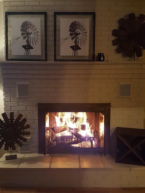 Enjoy the wood burning fireplace in the living room area on the first floor.
