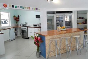 Spacious kitchen area with many appliances