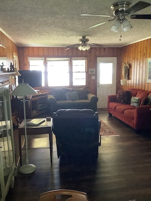 Our cozy den has a view of the lake and opens to the screen porch.  