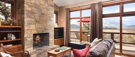 Enjoy a roaring fire as you look out at the expansive valley below. 