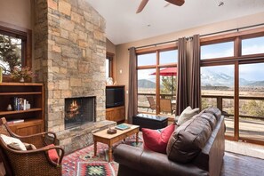 Enjoy a roaring fire as you look out at the expansive valley below. 