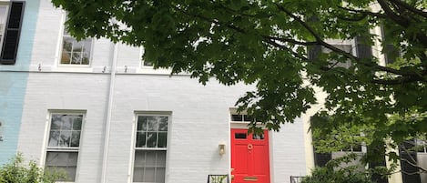 Red Front Door of Dent Place in Row of 1900-era Historic Townhouses.