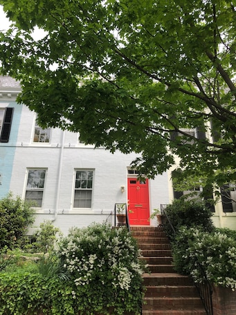 Red Front Door of Dent Place in Row of 1900-era Historic Townhouses.