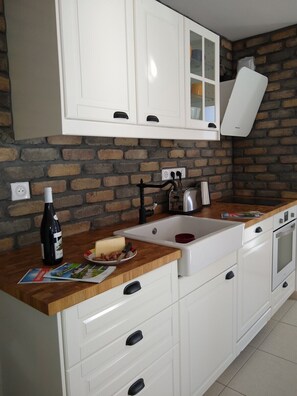 The lovely open plan kitchen has a dishwasher and is equipped to an extremely high level for self catered holidays.