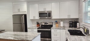 Kitchen has everything necessary:
toaster, mixer/blender, pans, pots, dishes ...