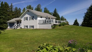 Front of house with side deck.