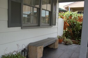 Bench seating on front porch.
