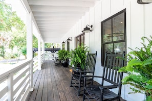 Front porch with 4 rocking chairs - the perfect place to relax and read a book