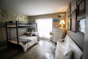 The main floor bedroom bunkbed is a double + single w comfy bedding/mattresses