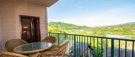 Balcony has table and 4-chairs available for guests.