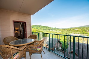 Balcony has table and 4-chairs available for guests.