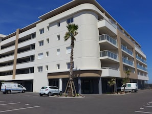 Building, Wheel, Sky, Car, Property, Window, Vehicle, Plant