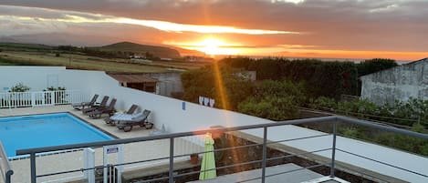 Beautiful sunset view from the balcony above the pool