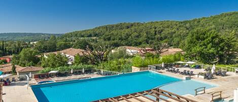 Dive into the outdoor pool on a hot summer day.