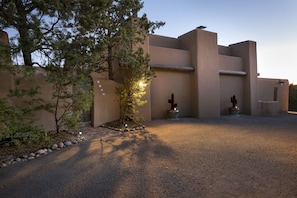 Front of the house - Turquoise gate leads to lovely brick courtyard. 