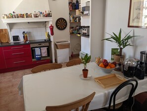 Open plan kitchen with large dining table