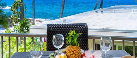 Table and chair in the lanai of our ocean front condo