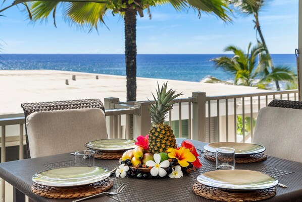 Table and chair in the lanai of our ocean front condo