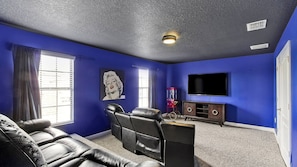Family movie room with theater seating for 5