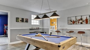 Family pool table and play are in the loft by the movie room