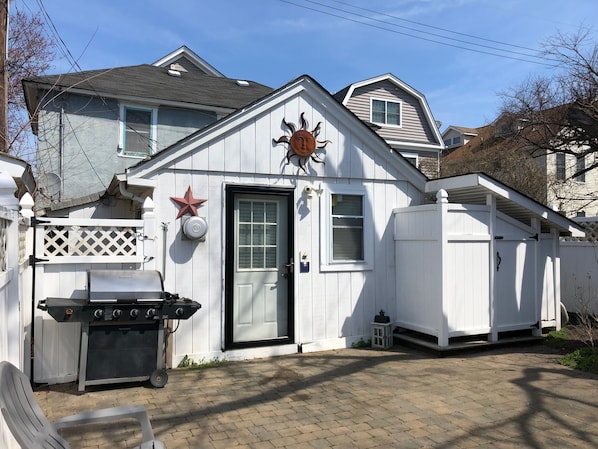 Front of house, including grill and outdoor shower 