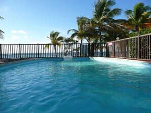 swimming pool in front of sea