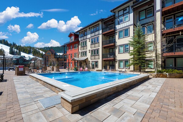 New Large Year Round hot tub out back door of condo!