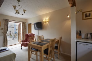 Kitchen Lounge dining with French doors to decking terrace