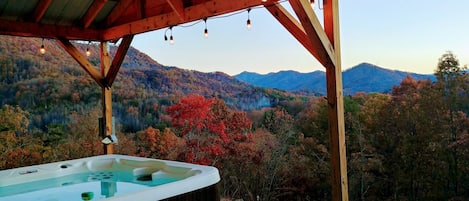 Relax in the covered hot tub with astounding views. String Lights.