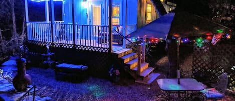 Evening view toward front porch and outside seating area