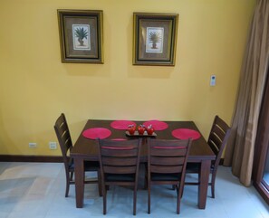 Dining room table seats 6. Comfortably padded bench on side near wall.