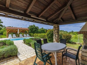Plant, Property, Table, Furniture, Sky, Chair, Shade, Interior Design, Grass, Landscape