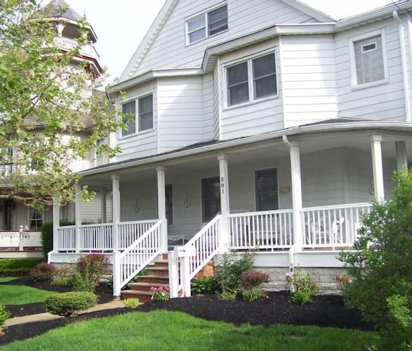 The Front Porch with wicker chairs is a quiet place to sit and visit.