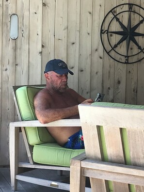 Shaded pool lounge with outdoor bluetooth equipped stereo
